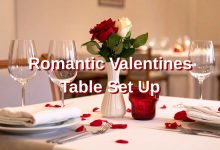 Romantic Valentines Table Set Up with elegant red and pink table decor