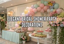 elegant bridal shower party decorations with balloons floral backdrop and dessert table setup