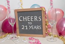 Letter board with “Cheers to 21 Years” and champagne glasses styled for a birthday Instagram post