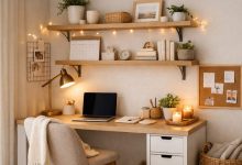 Small work from home space with minimalist desk, wall shelves, cozy lighting, and organized decor in a tiny home office