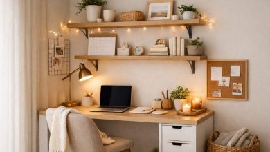 Small work from home space with minimalist desk, wall shelves, cozy lighting, and organized decor in a tiny home office