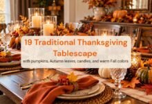 Traditional Thanksgiving tablescape with pumpkins, autumn leaves, candles, and warm fall colors